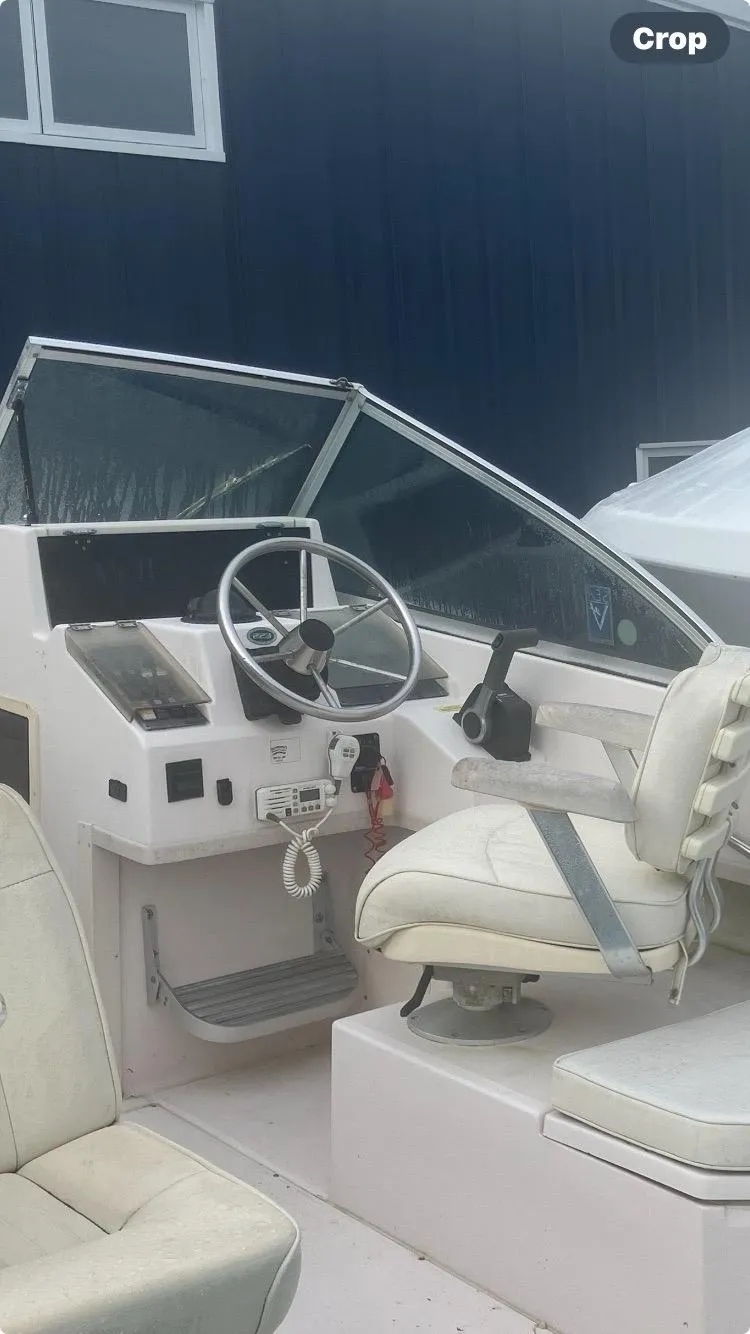Slide: The Image of 2002 Grady-White 22 boat interior with steering wheel and seating. - 3