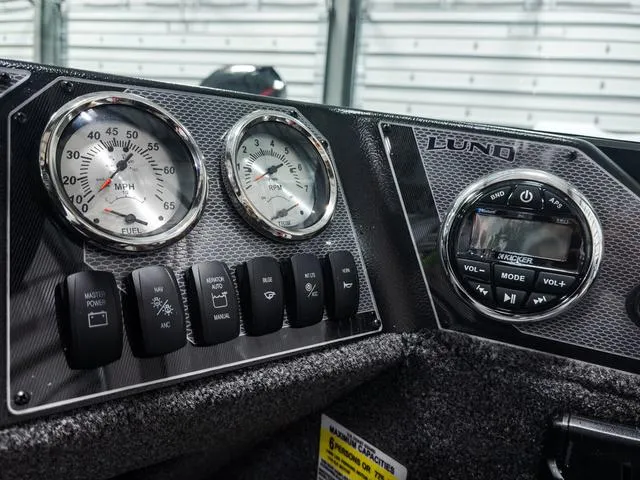 Slide: The Image of Dashboard of 2025 Lund 1775 Adventure Sport boat with gauges and controls. - 10