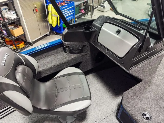 Slide: The Image of Interior of 2025 Lund 1775 Adventure Sport boat with seating and dashboard. - 12
