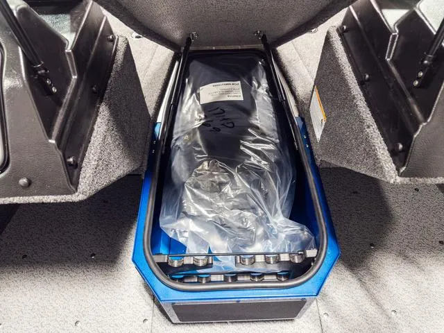 Slide: The Image of 2025 Lund 1775 Adventure Sport storage compartment with packaged equipment. - 15