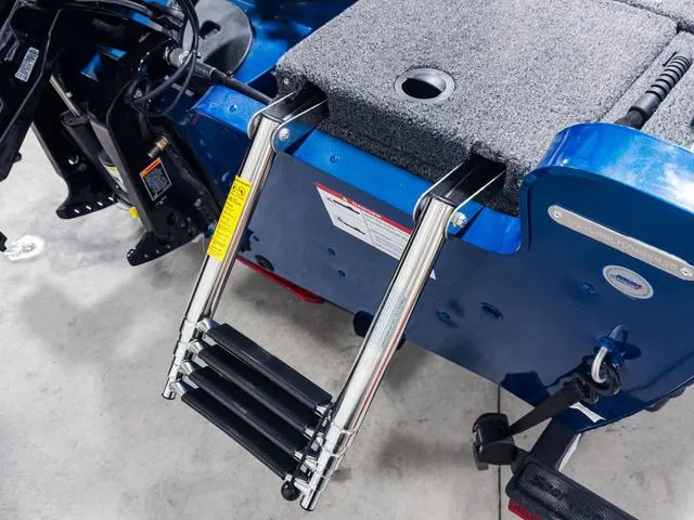 Slide: The Image of 2025 Lund 1775 Adventure Sport boat with foldable ladder and carpeted deck. - 19