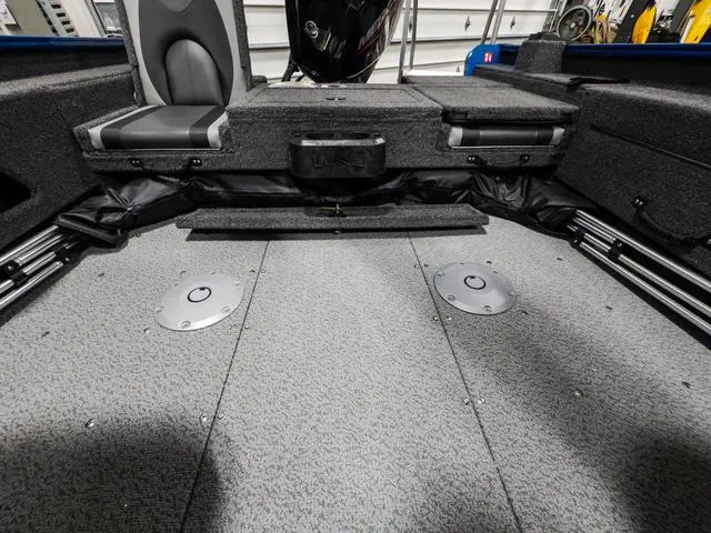 Slide: The Image of 2025 Lund 1775 Adventure Sport boat interior with seating and storage compartments. - 8