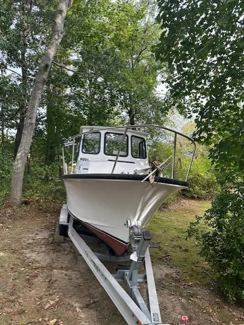 Slide: The Image of 2007 Eastern Pilothouse boat on trailer in wooded area. - 3