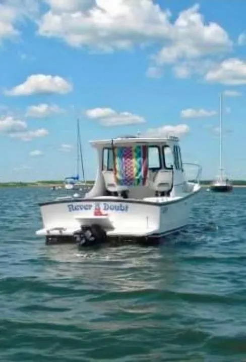 Slide: The Image of 2007 Eastern Pilothouse boat on water under blue sky with clouds. - 8