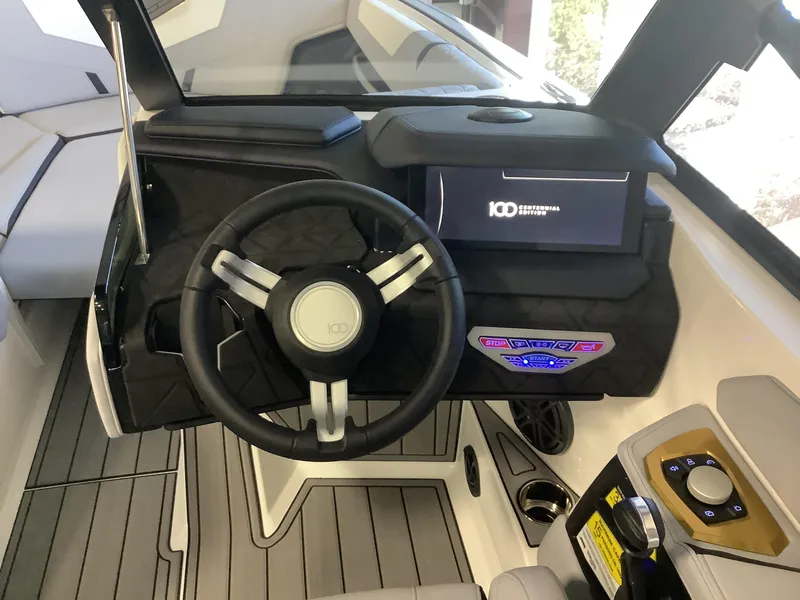 Slide: The Image of 2025 Nautique GS22 boat cockpit with modern steering and control panel. - 10
