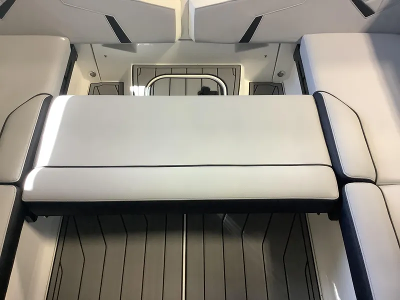 Slide: The Image of 2025 Nautique GS22 boat interior with sleek seating and modern design. - 21