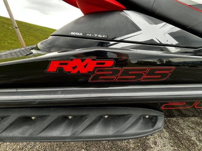Slide: The Image of 2011 Sea-Doo RXP 255 jet ski with Rotax 4-TEC engine branding. - 19