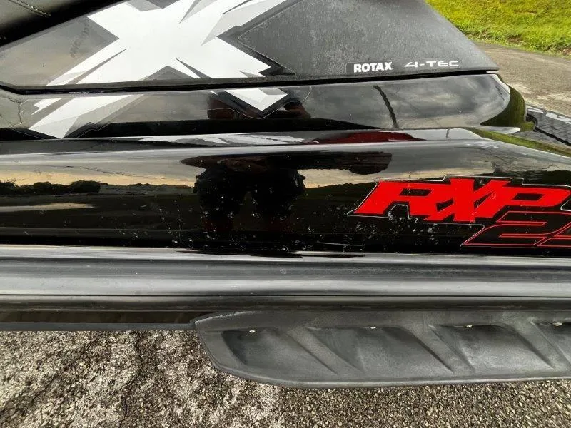 Slide: The Image of 2011 Sea-Doo RXP 255 jet ski with Rotax 4-TEC engine branding. - 21