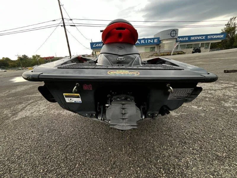 Slide: The Image of 2011 Sea-Doo RXP 255 jet ski rear view in parking lot. - 24