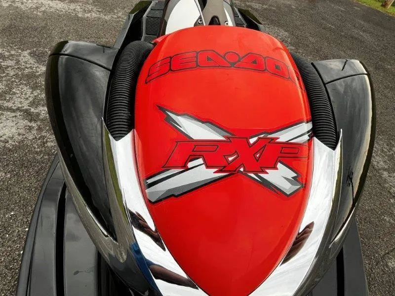 Slide: The Image of 2011 Sea-Doo RXP 255 jet ski, red and black design, top view. - 31