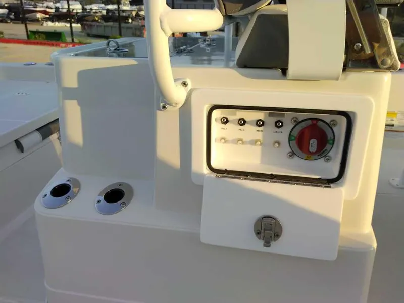 Slide: The Image of 2024 Ranger 2510 Bay boat control panel with steering wheel and switches. - 12