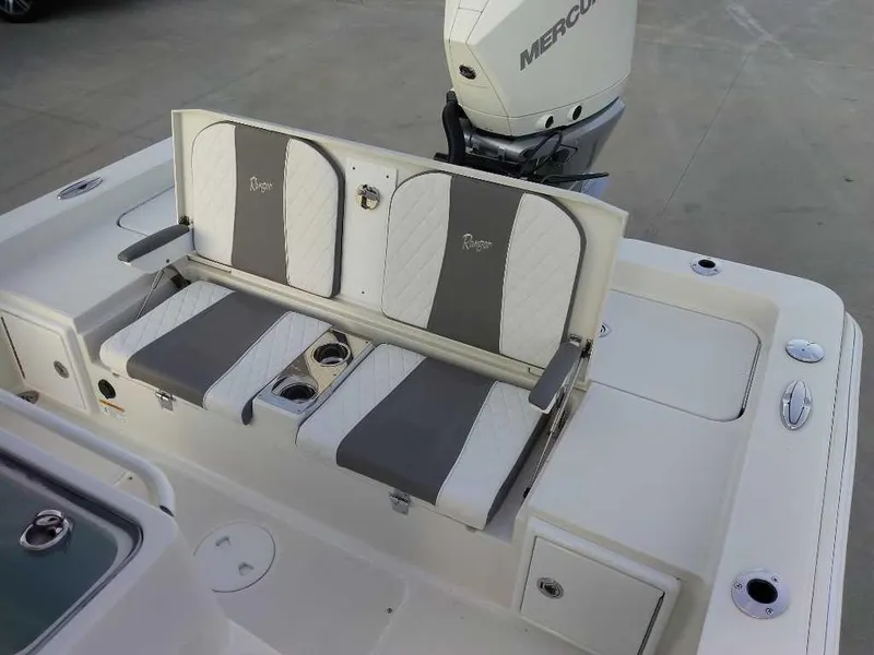 Slide: The Image of 2024 Ranger 2510 Bay boat seating with cup holders and Mercury engine. - 6