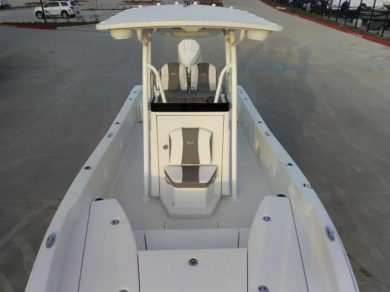 Slide: The Image of 2024 Ranger 2510 Bay boat, white deck, center console, outdoor setting. - 9