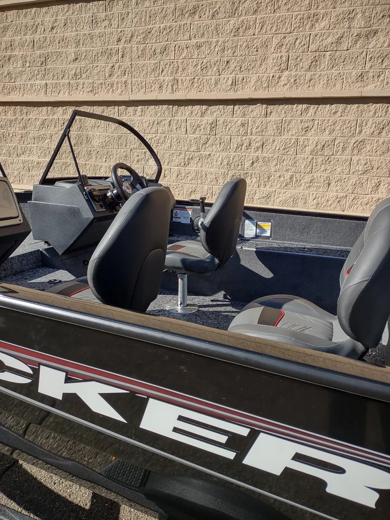 Slide: The Image of 2025 Tracker Pro Guide V-175 WT boat interior with seating and steering console. - 6