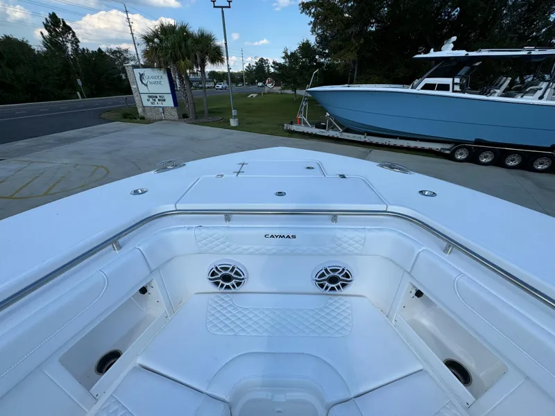 Slide: The Image of 2025 Caymas 401 CC boat deck with speakers and storage compartments. - 20