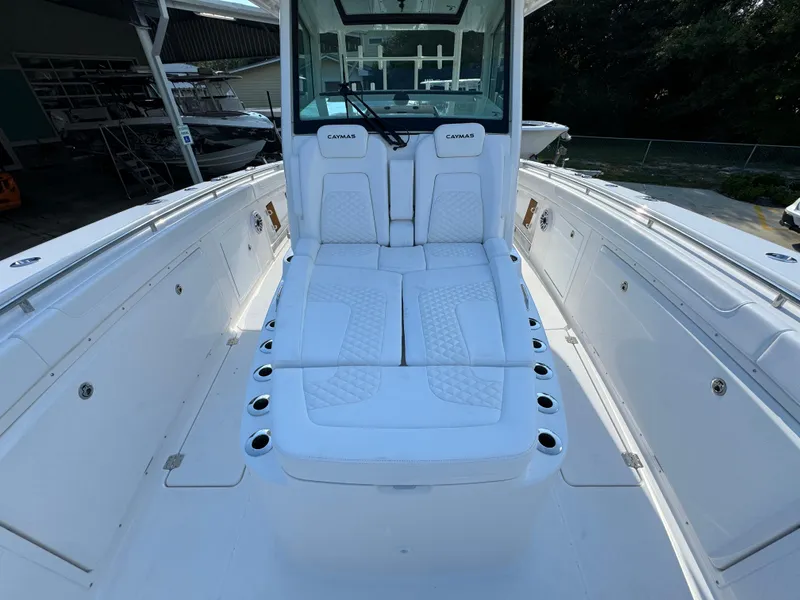 Slide: The Image of 2025 Caymas 401 CC boat interior with white seating and modern design. - 24