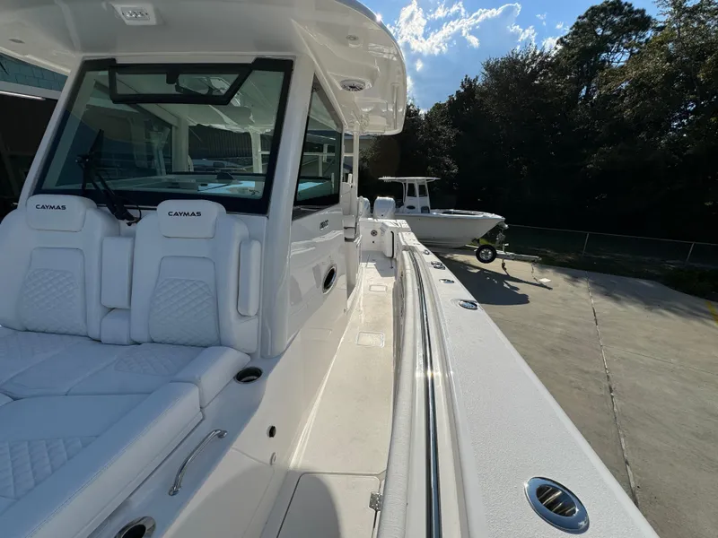 Slide: The Image of 2025 Caymas 401 CC boat with sleek white interior and modern design. - 25