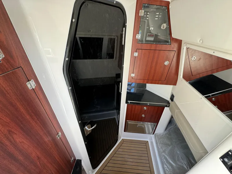 Slide: The Image of 2025 Caymas 401 CC cabin interior with wood accents and modern design. - 28