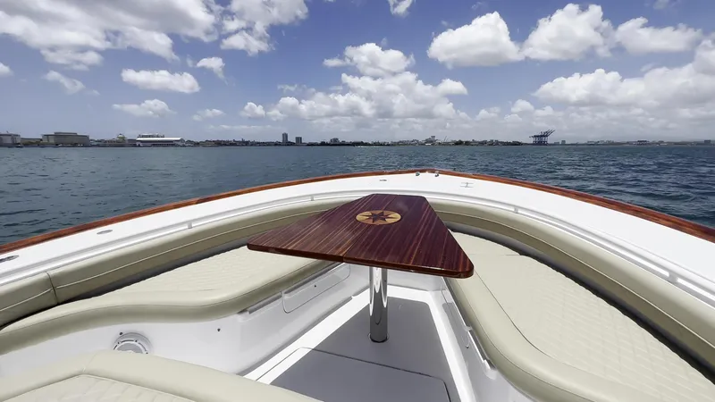 Slide: The Image of Luxurious 2025 Vicem CC yacht with elegant seating and table, cruising on a sunny day. - 3