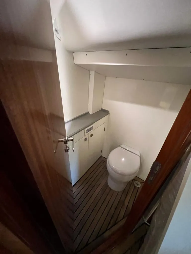 Slide: The Image of Compact bathroom in 2025 Vicem CC boat with wooden flooring and modern fixtures. - 6