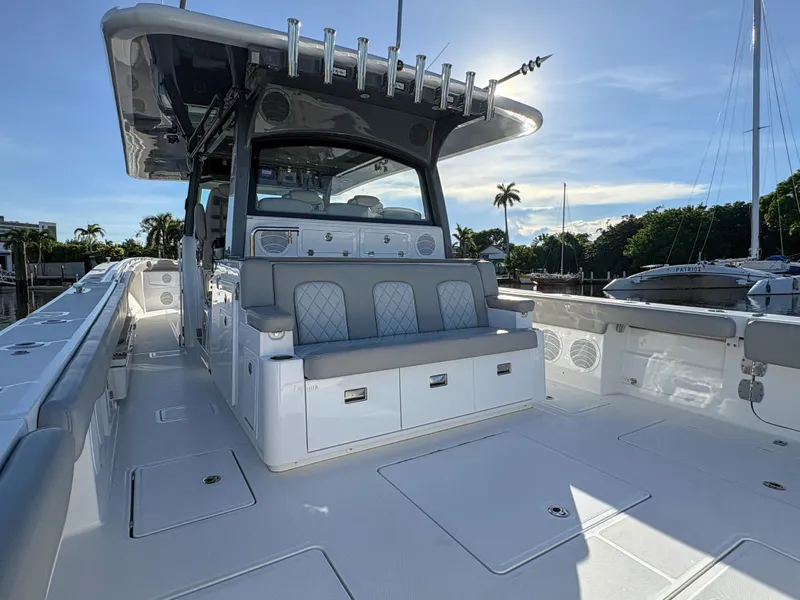 Slide: The Image of 2023 HCB 53 Sueños luxury boat with spacious deck and seating. - 13