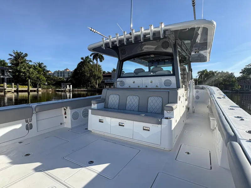 Slide: The Image of 2023 HCB 53 Sueños luxury boat with spacious deck and seating. - 15