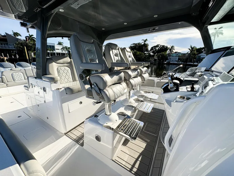 Slide: The Image of Luxurious interior of 2023 HCB 53 Sueños boat with plush seating and modern controls. - 25