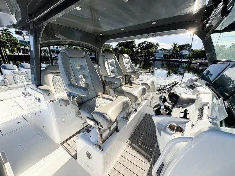 Slide: The Image of Luxurious 2023 HCB 53 Sueños boat interior with plush seating and modern controls. - 28
