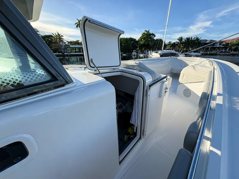 Slide: The Image of 2023 HCB 53 Sueños boat deck with open storage compartment. - 42