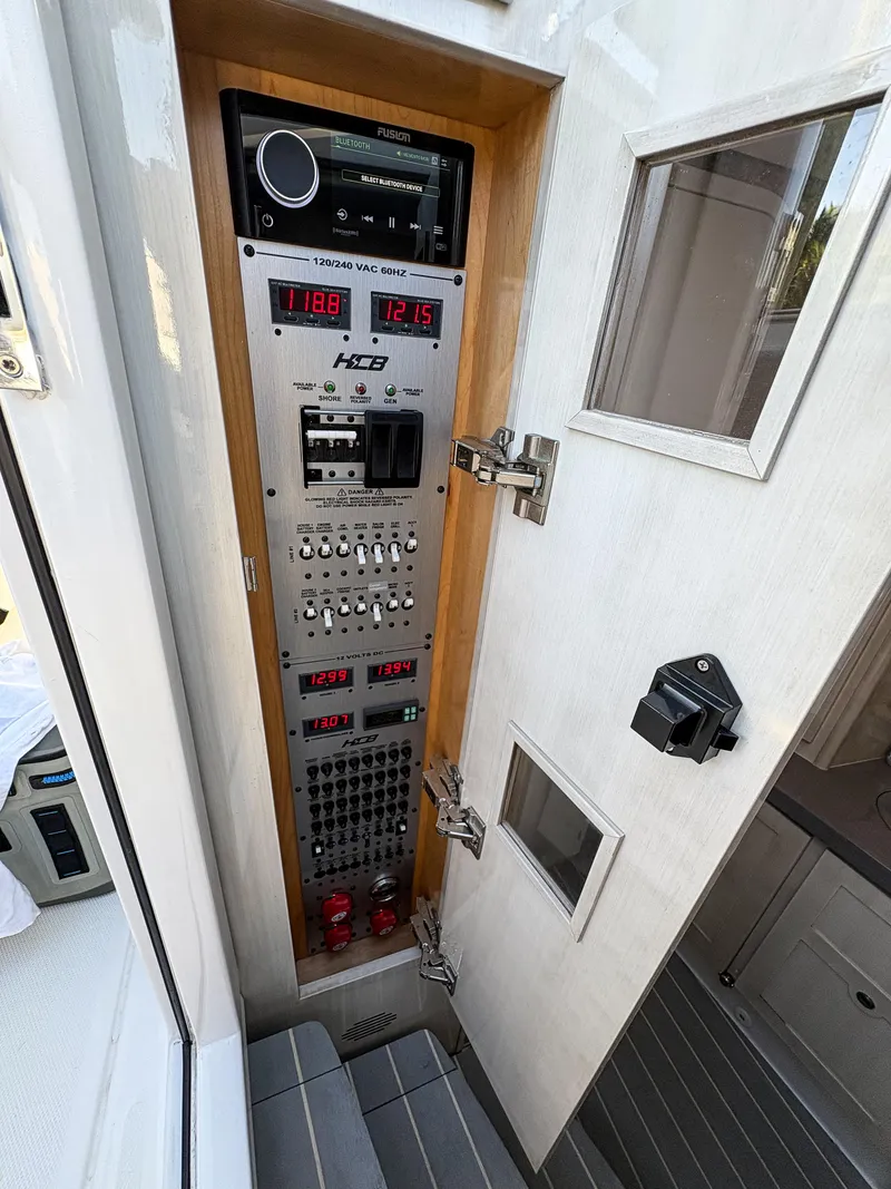 Slide: The Image of Control panel inside 2023 HCB 53 Sueños boat, featuring advanced navigation and monitoring systems. - 44