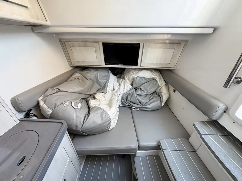 Slide: The Image of 2023 HCB 53 Sueños cabin interior with seating and storage. - 45