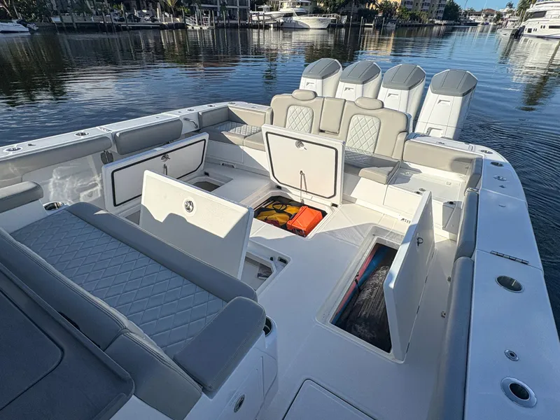 Slide: The Image of 2023 HCB 53 Sueños boat interior with open storage compartments and seating. - 8