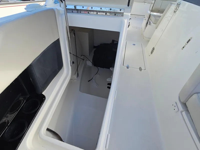 Slide: The Image of 2018 Boston Whaler 270 Vantage storage compartment, open and spacious interior view. - 5