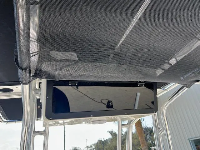Slide: The Image of Key West 203 FS 2025 boat canopy with storage compartment. - 7