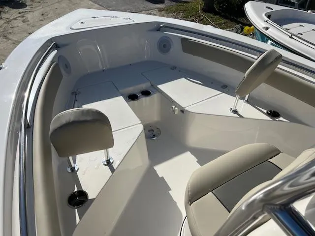 Slide: The Image of 2025 Key West 203 FS boat interior with seating and storage compartments. - 8
