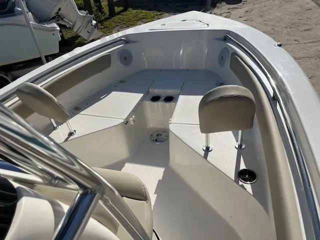 Slide: The Image of 2025 Key West 203 FS boat interior with seating and storage compartments. - 9
