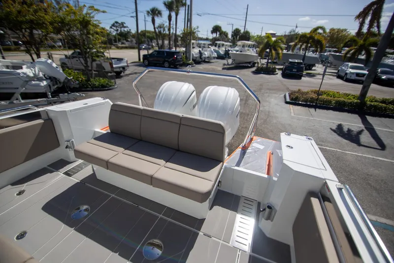 Slide: The Image of 2025 Quarken 35 Cabin boat with spacious seating and dual engines in a marina setting. - 16