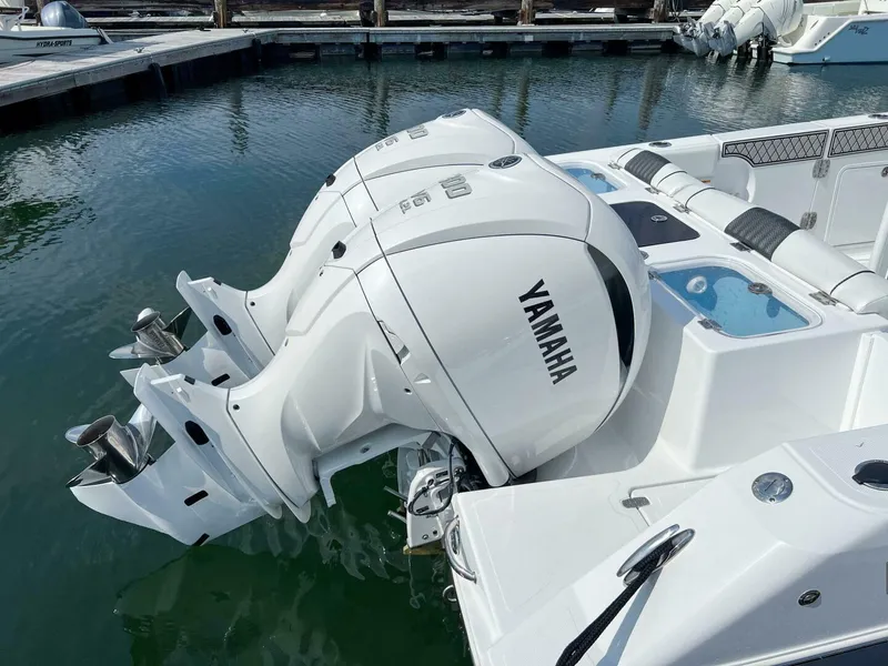 Slide: The Image of 2024 Wellcraft 302 Fisherman with twin Yamaha outboard engines docked in marina. - 12