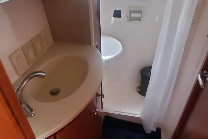 Slide: The Image of Bathroom interior of 2001 Tiara Yachts 52 Express Cruiser with sink and shower. - 15
