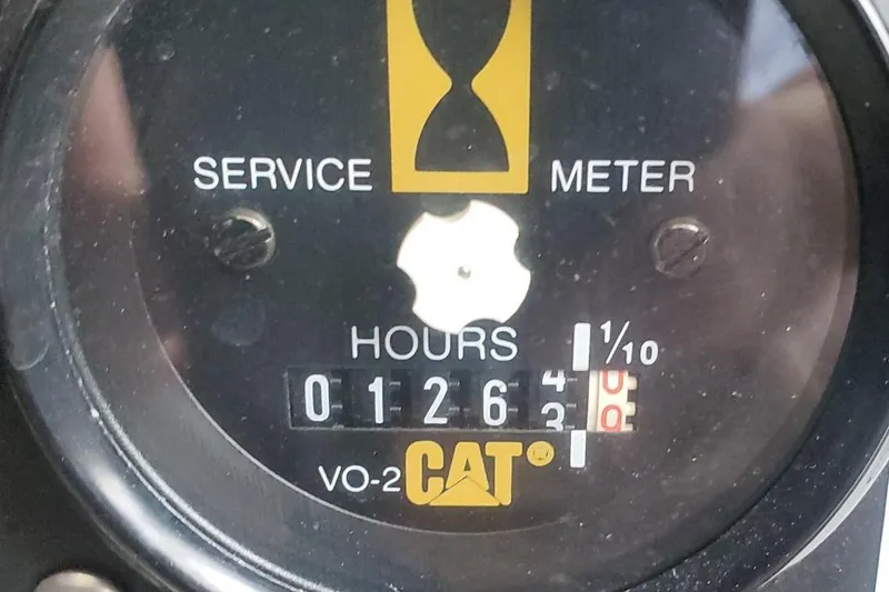 Slide: The Image of Service meter showing 126.3 hours on a 2001 Tiara Yachts 52 Express Cruiser. - 20