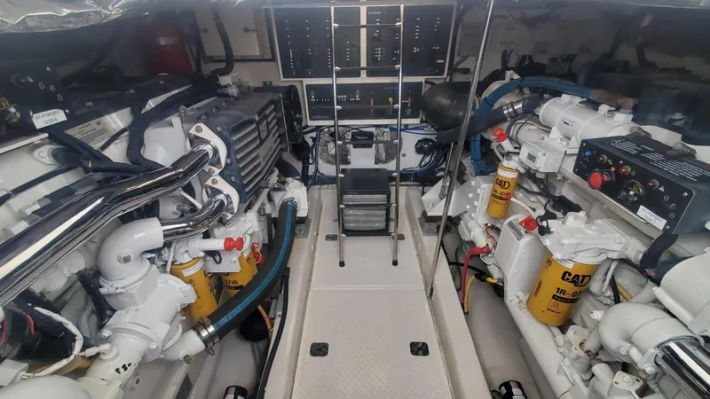 Slide: The Image of Engine room of 2001 Tiara Yachts 52 Express Cruiser, showcasing mechanical components and systems. - 22