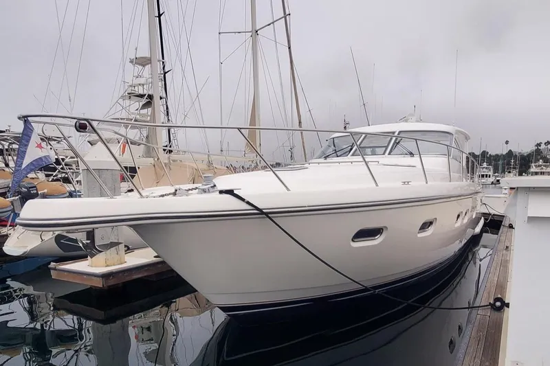 Slide: The Image of 2001 Tiara Yachts 52 Express Cruiser docked in marina. - 24