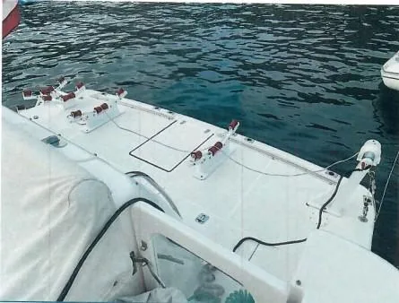 Slide: The Image of 2001 Tiara Yachts 52 Express Cruiser docked on calm water. - 26