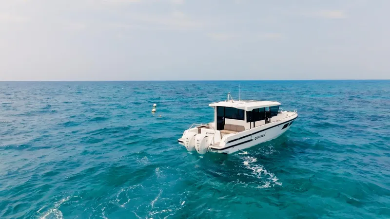 Slide: The Image of 2025 Quarken 35 Cabin boat cruising on open sea under clear sky. - 3
