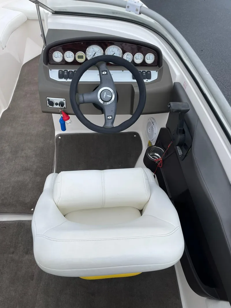 Slide: The Image of 2006 Regal 2000 Bowrider boat interior with steering wheel and dashboard. - 10