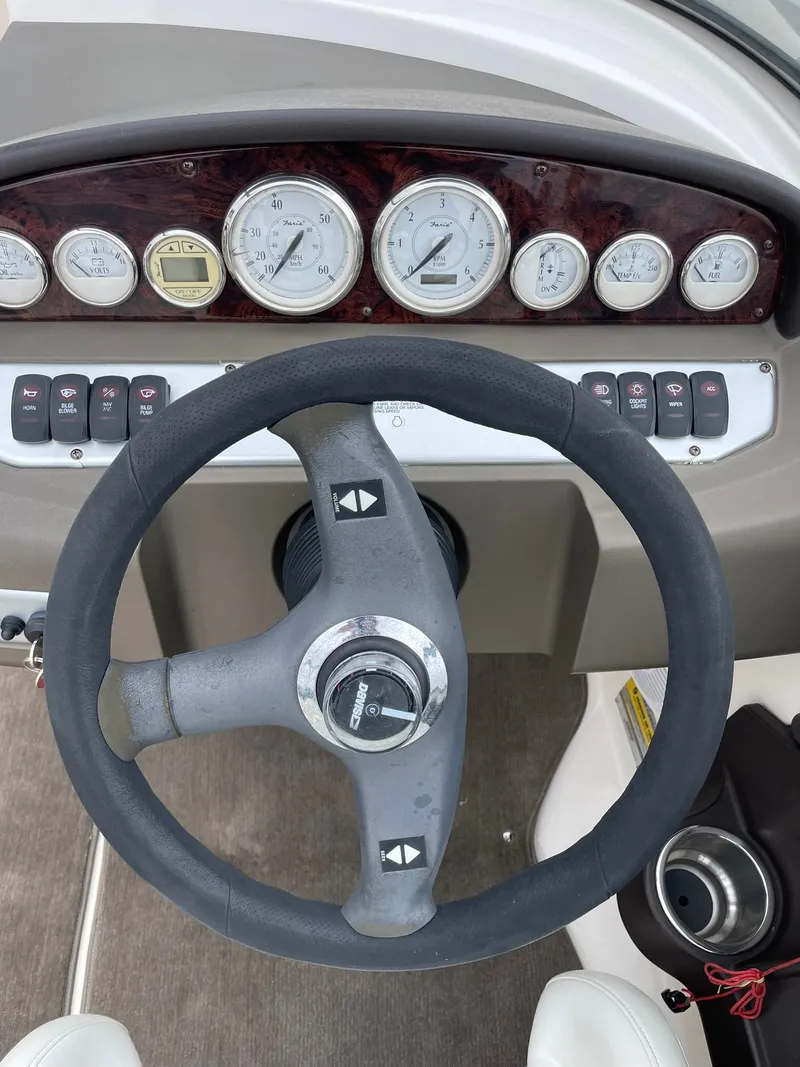 Slide: The Image of 2006 Regal 2000 Bowrider dashboard with steering wheel and gauges. - 11