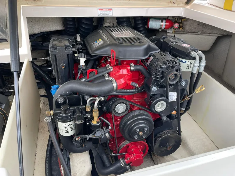 Slide: The Image of Engine compartment of a 2006 Regal 2000 Bowrider boat, showcasing detailed components. - 15