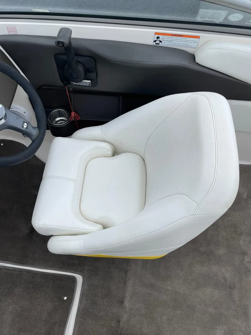 Slide: The Image of White captain's chair in 2006 Regal 2000 Bowrider boat interior. - 18