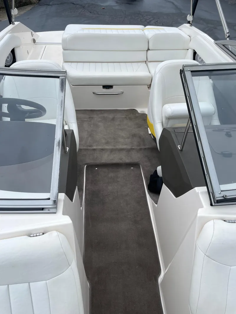 Slide: The Image of 2006 Regal 2000 Bowrider interior with white seating and gray carpet. - 22