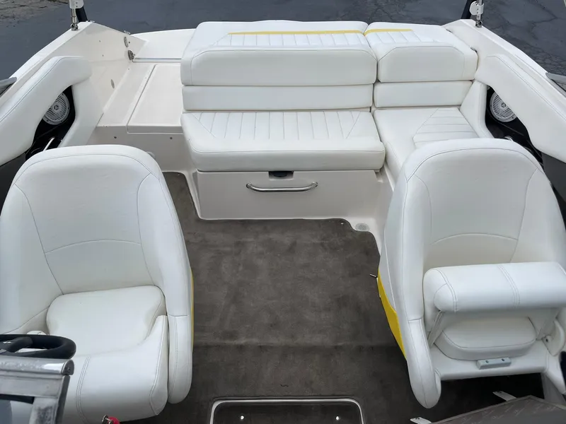 Slide: The Image of 2006 Regal 2000 Bowrider interior with white seating and carpeted floor. - 23
